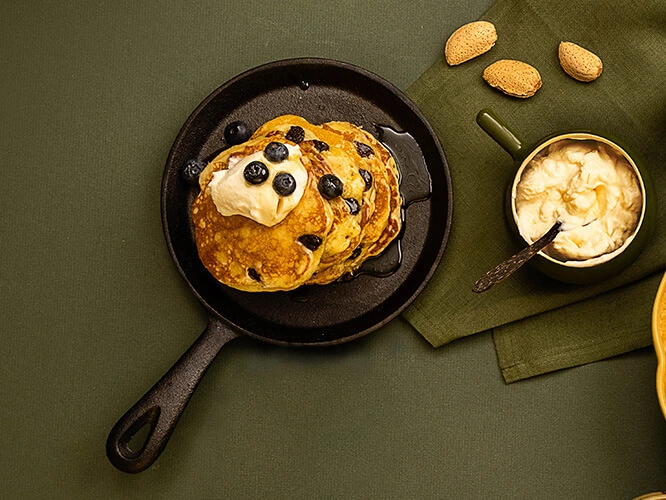 A pancake pan with freshly made Blueberry Buttermilk panckes.