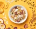 Gourmet Muesli - a bowl of Summer Muesli surrounded by ingredients such as pineapple, strawberry, apple, pistachio and coconut.